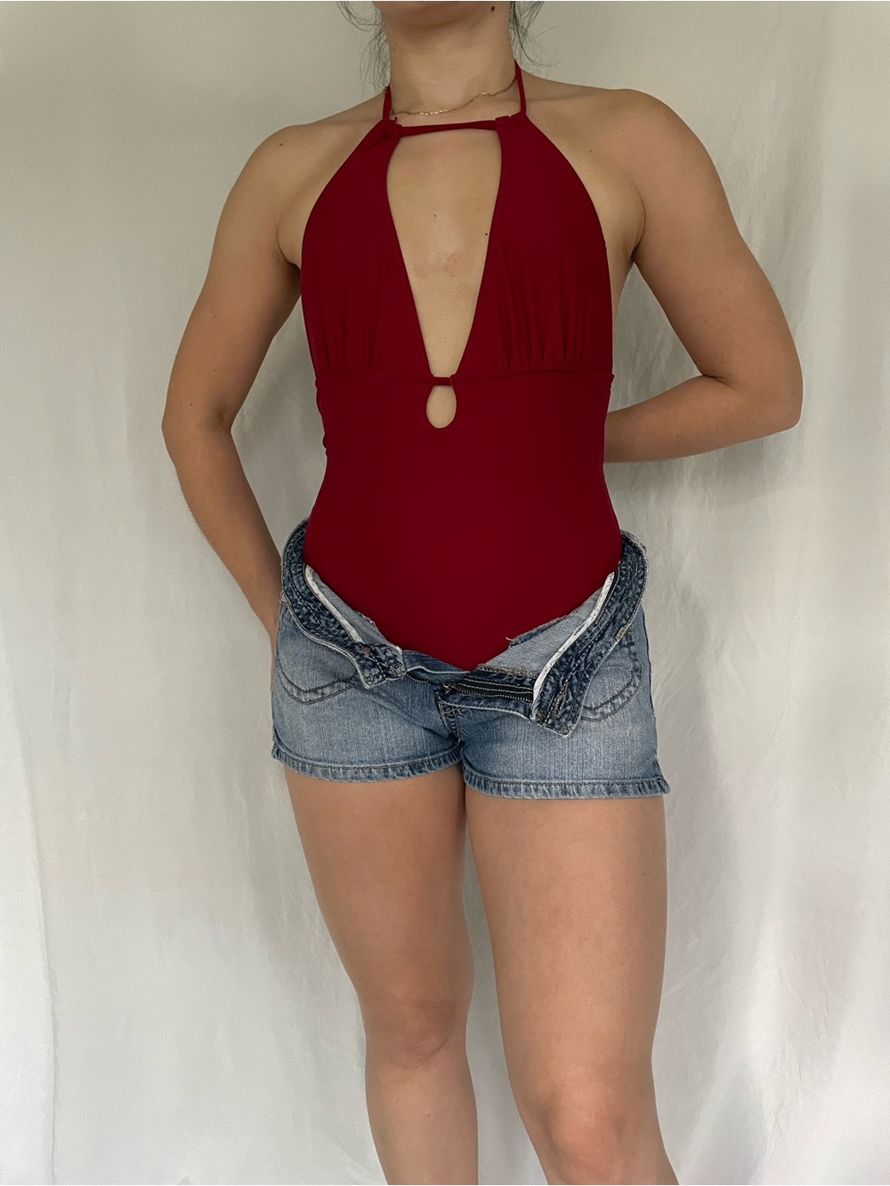 Burgundy halter neck swimsuit with cutout detail